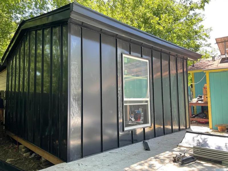 Black standing seam metal wall panels for Roof Inspection in Lisle